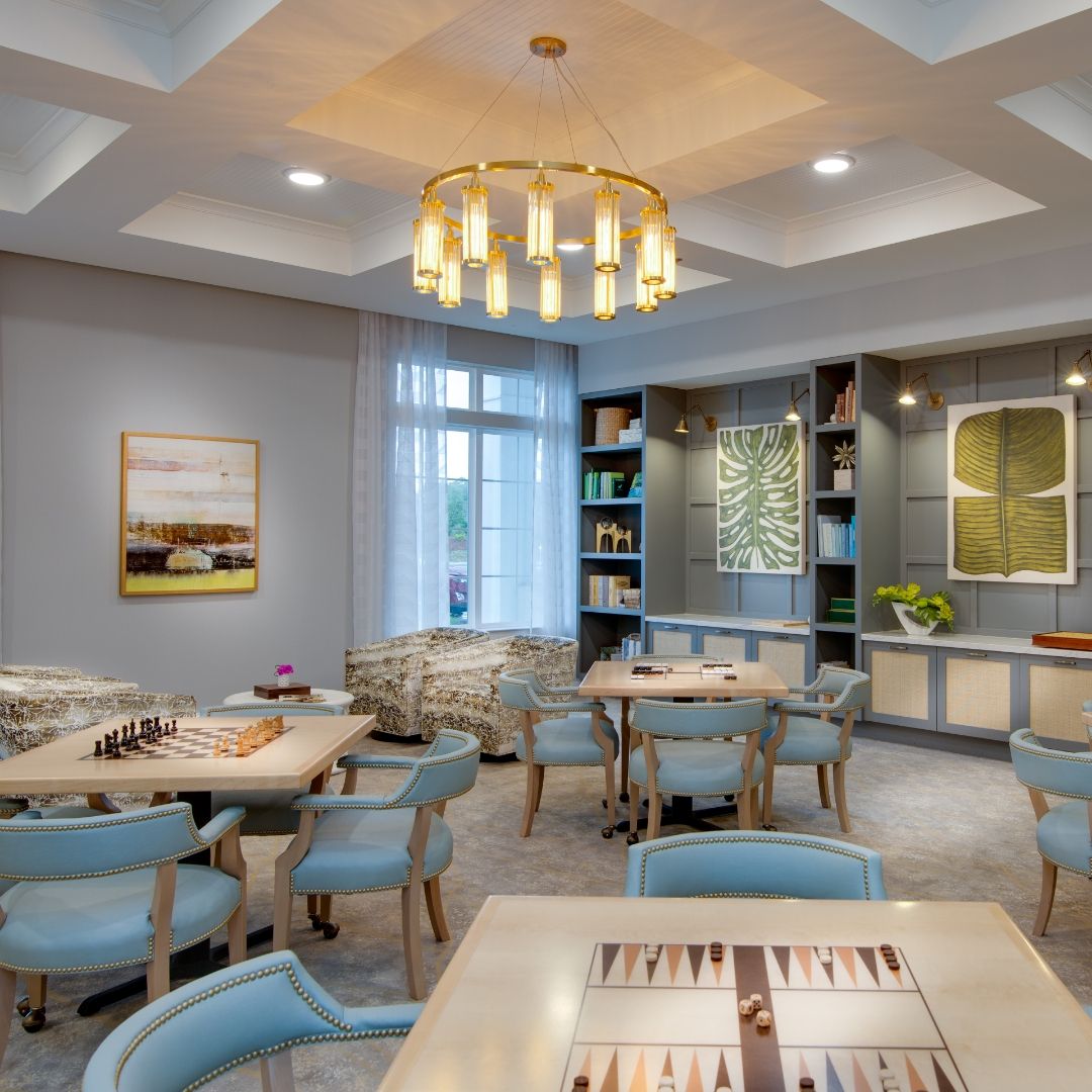 A modern, well-lit dining area with elegant decor and comfortable seating.