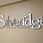 A wall-mounted sign for Silveridge, an Everbrite Community.