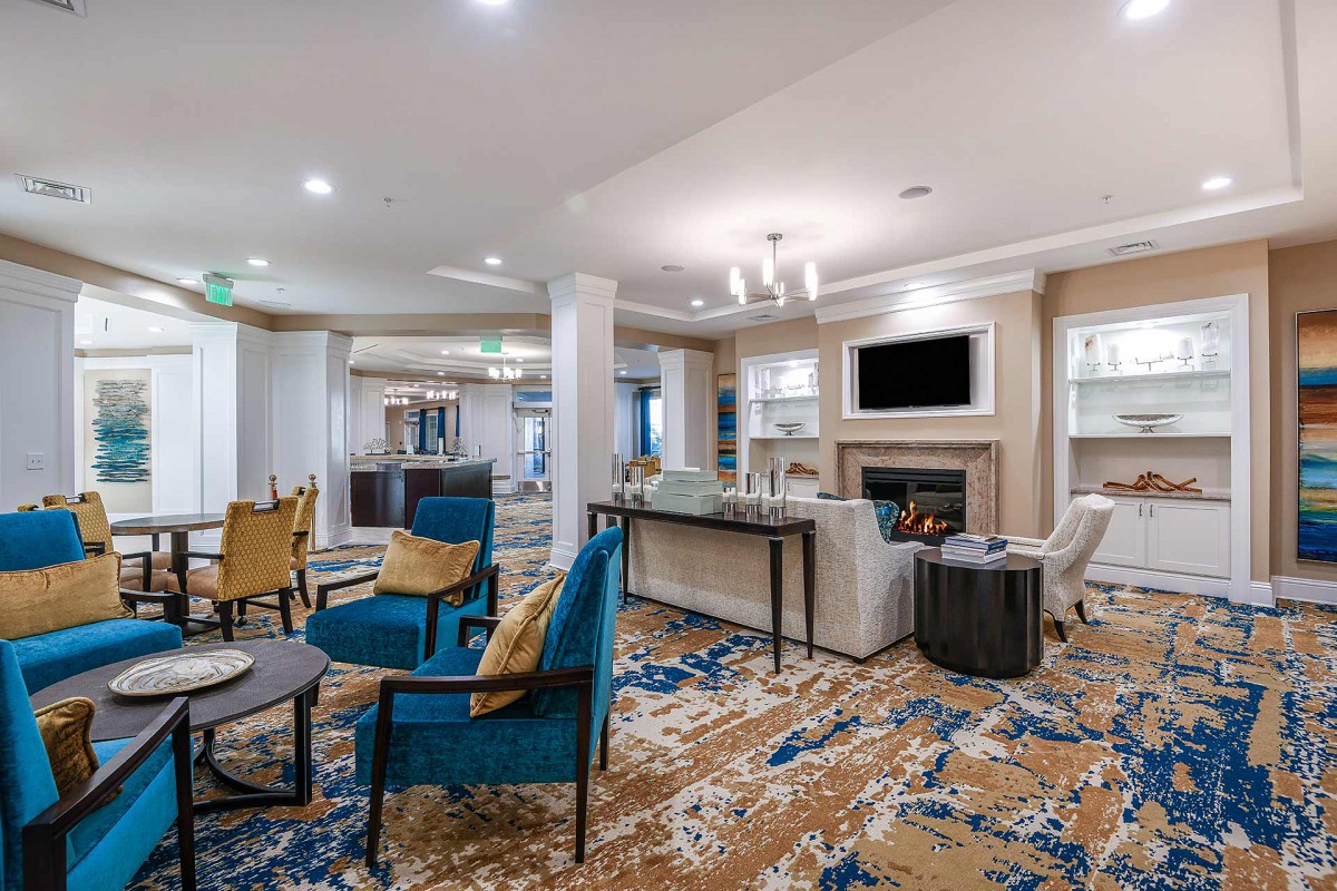 A modern living room with elegant furnishings and a cozy fireplace.