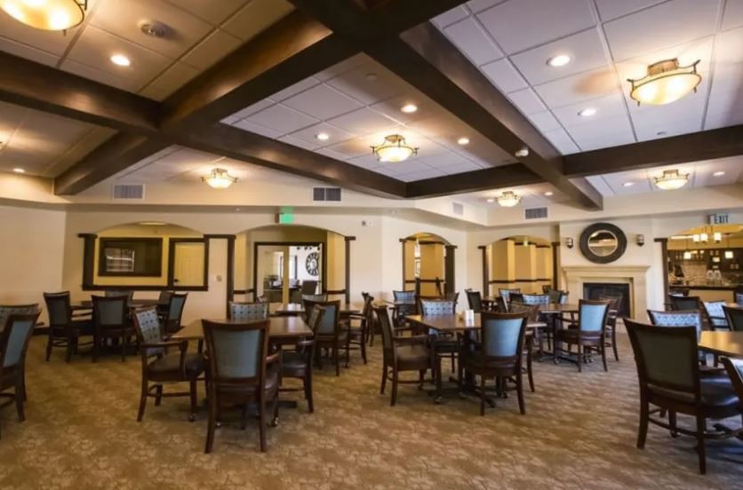 An elegant dining area with stylish furniture and ambient lighting.