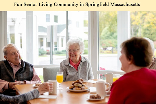 Residents enjoying breakfast and conversation in a senior living community in Springfield, Massachusetts.