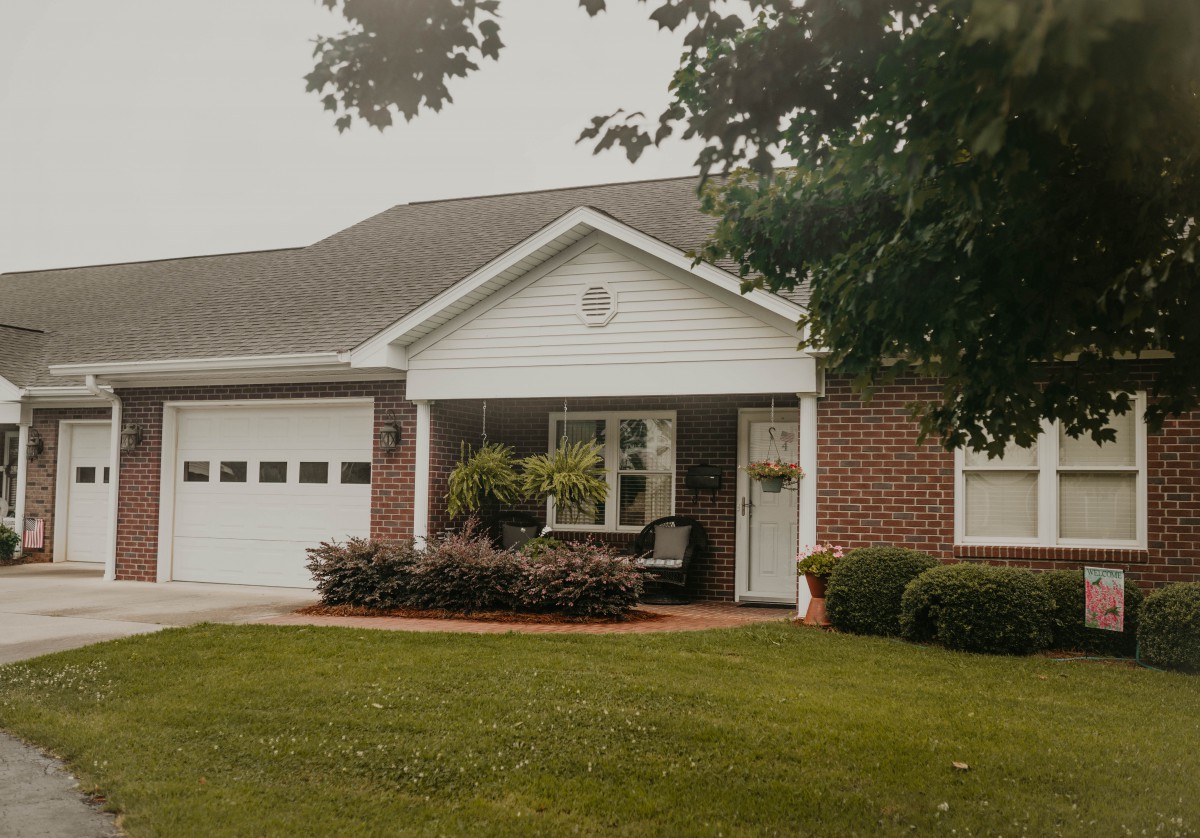 A charming suburban house with a well-kept front yard.