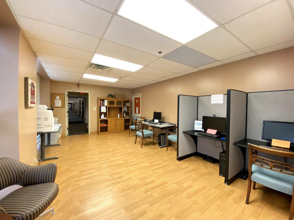 An open office area with cubicles and computers.