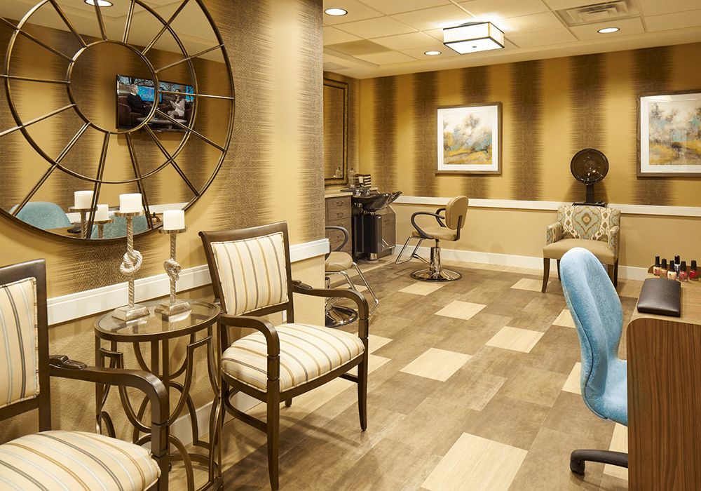 A stylish salon waiting area with comfortable seating and elegant decor.