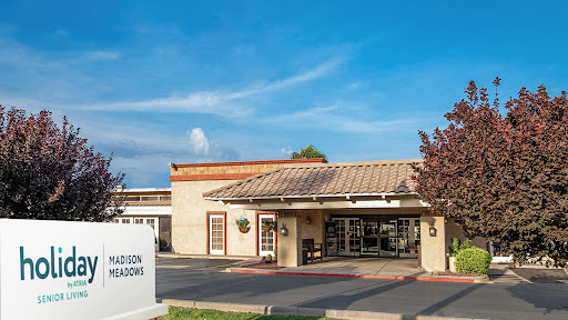 A charming commercial building under a clear blue sky.