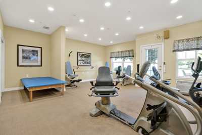 A well-equipped gym with exercise machines and a wellness area.