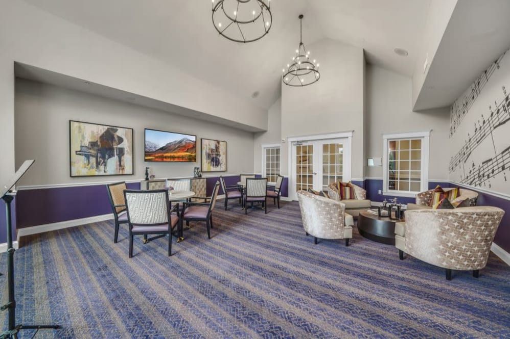 A spacious and elegantly decorated lounge area with comfortable seating and modern artwork adorning the walls.