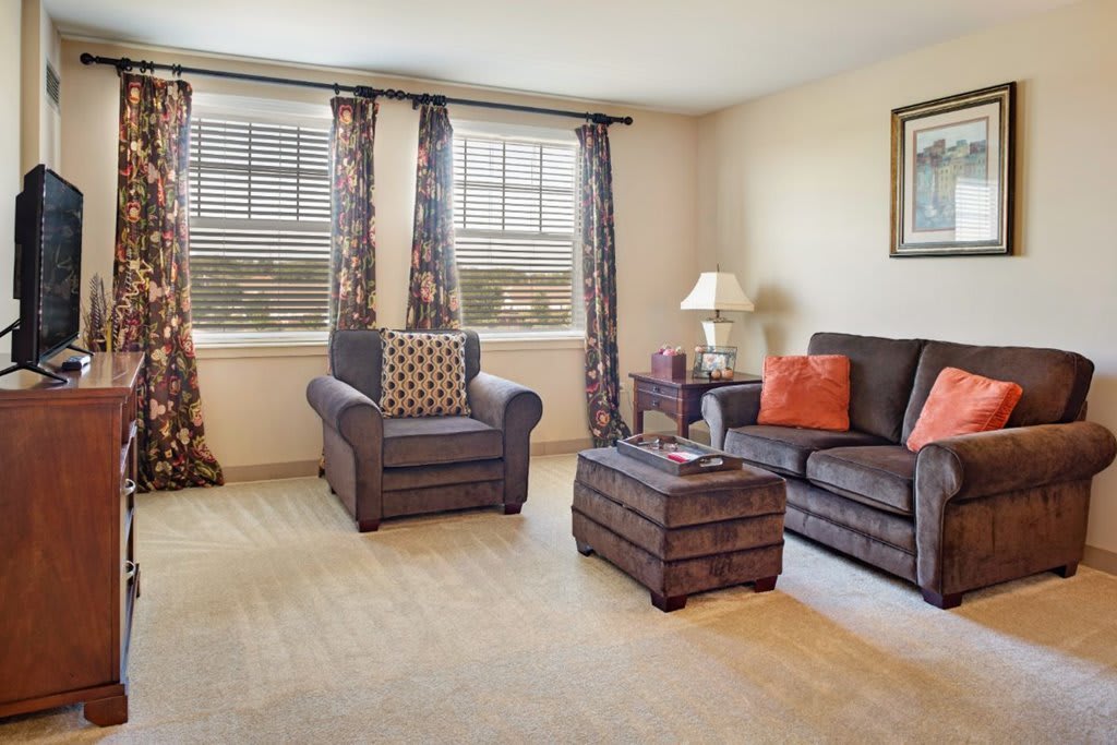 A cozy living room with modern furniture and a warm atmosphere.