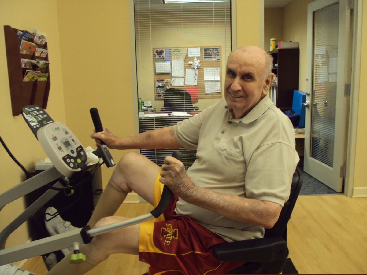 A person exercising on a stationary bike indoors.