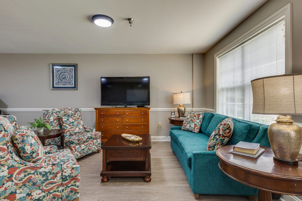 A cozy living room with comfortable seating and a television.