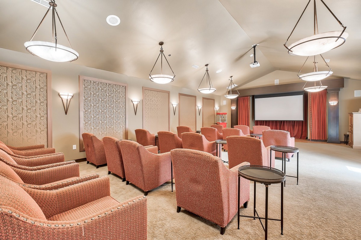 A cozy theater room with comfortable seating and a large screen.