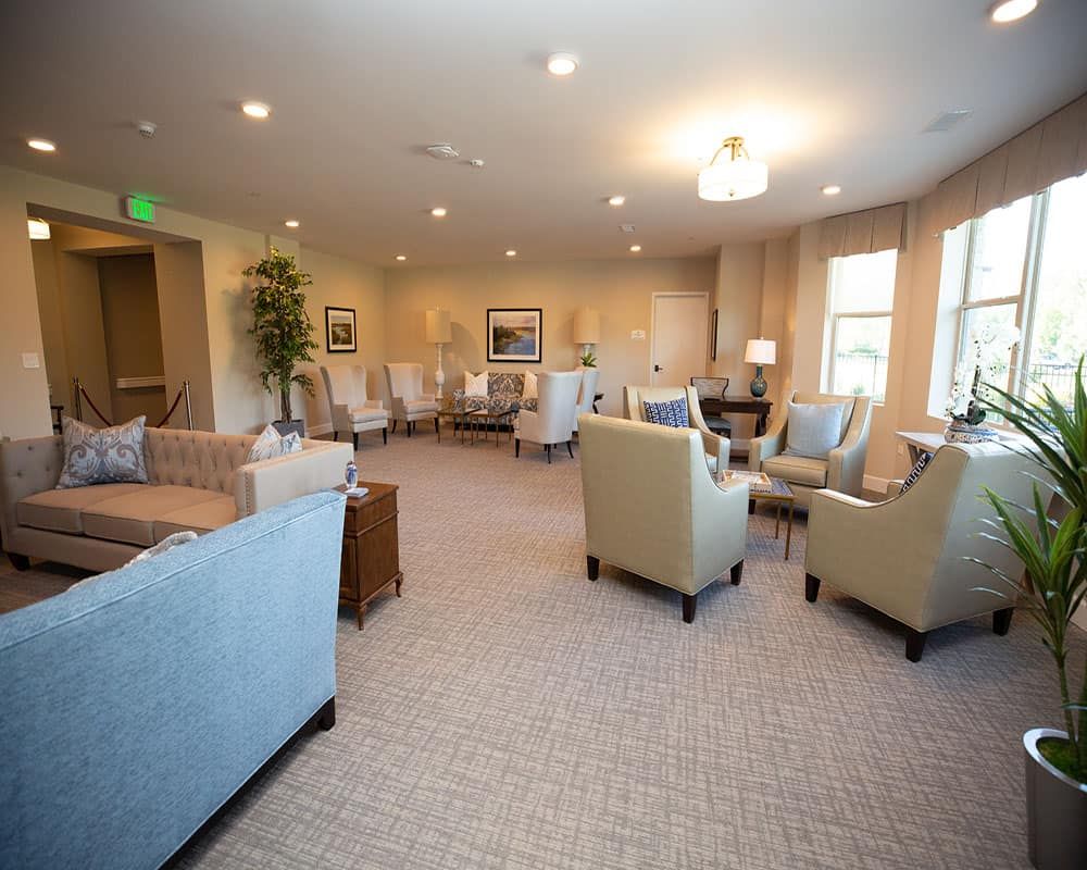 Spacious and elegantly furnished living room with comfortable seating.