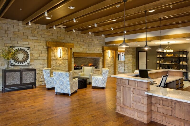 A modern and cozy lobby area with comfortable seating and warm lighting.