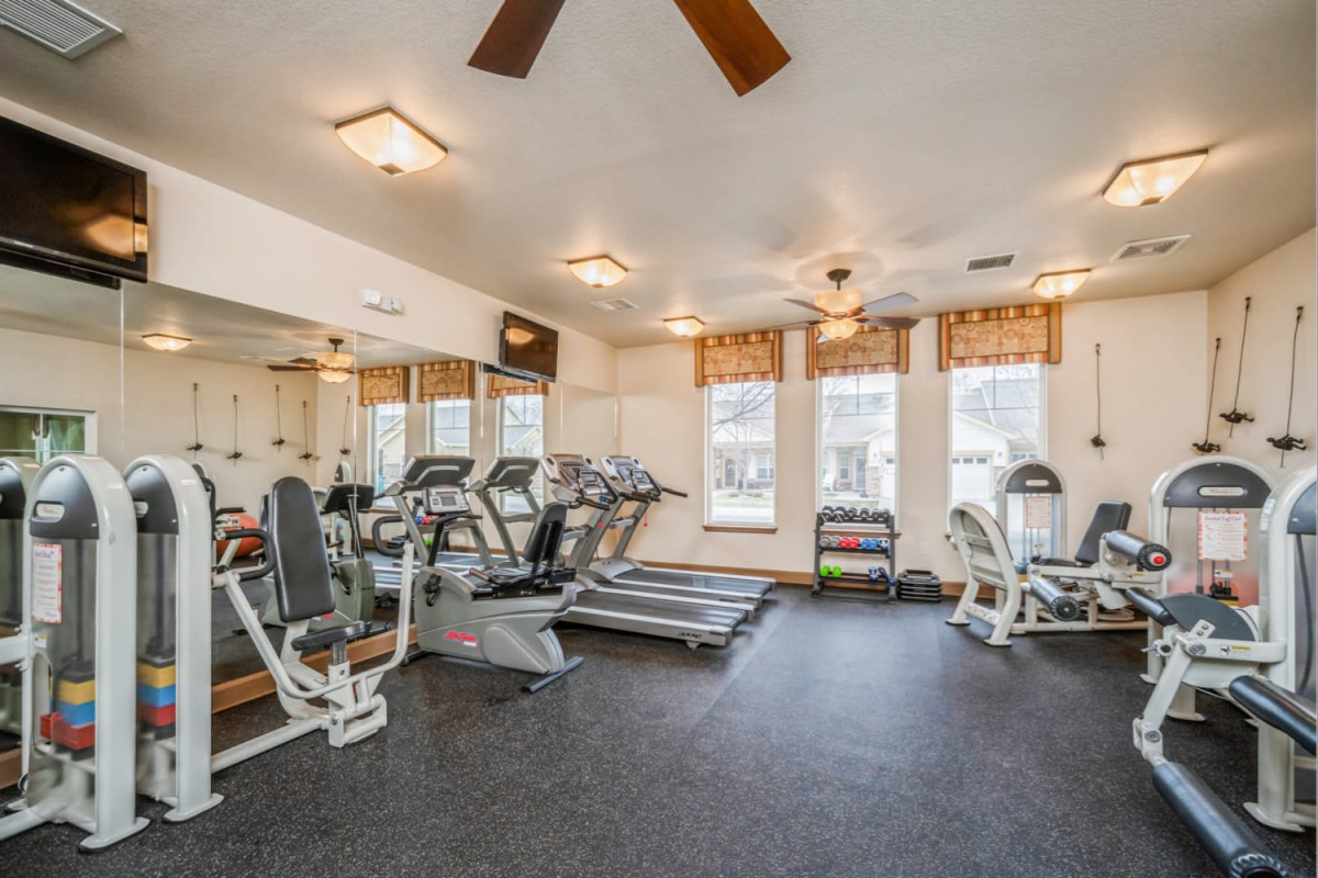 A well-equipped gym with treadmills and exercise bikes.