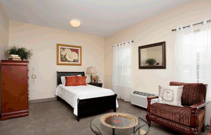 A cozy bedroom with a single bed and elegant decor.