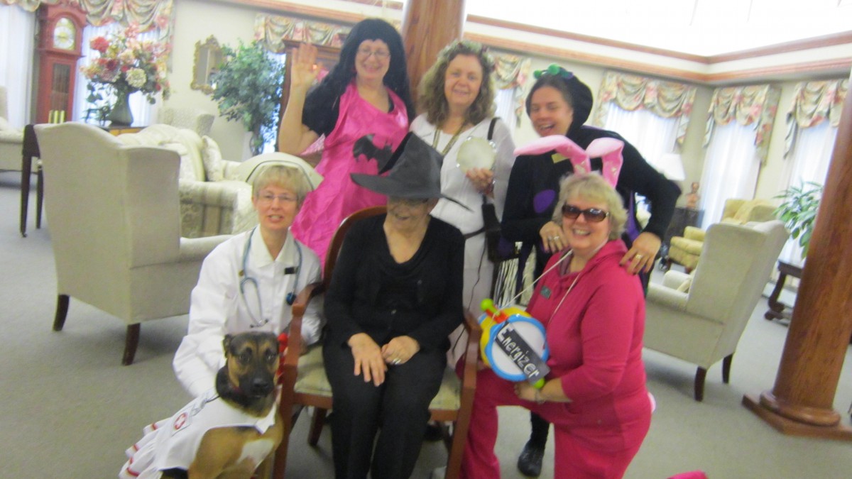 A group of people dressed in various costumes, likely celebrating a festive event.