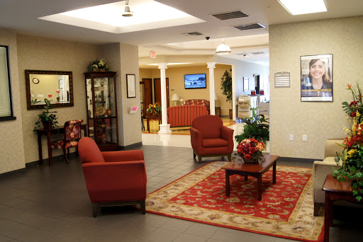 A cozy lobby area featuring red seating and decorative elements, creating a welcoming atmosphere.