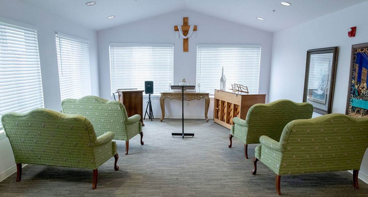 A small chapel with an altar and seating arrangements.