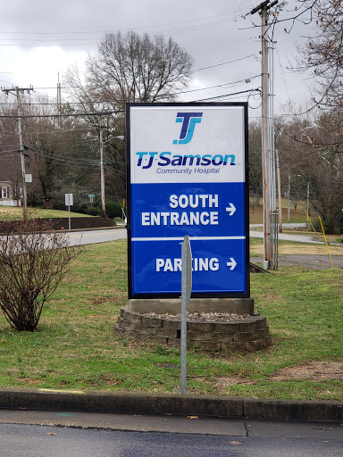 Directional sign for TJ Samson, indicating the south entrance and parking area.