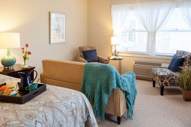 A cozy living room with comfortable seating and warm lighting.