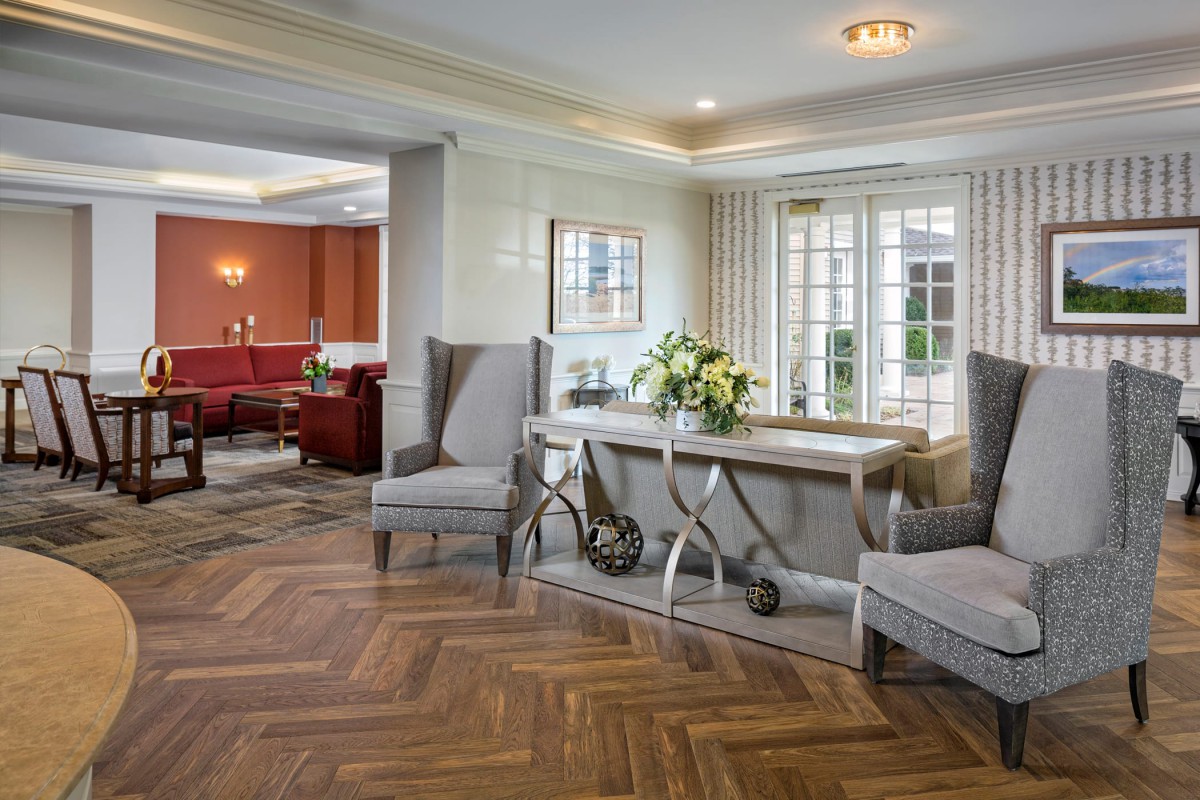 A luxurious and elegantly designed living room with modern furniture and bright lighting.