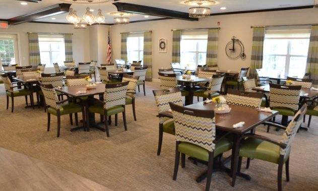 A well-decorated dining area with multiple tables and chairs.