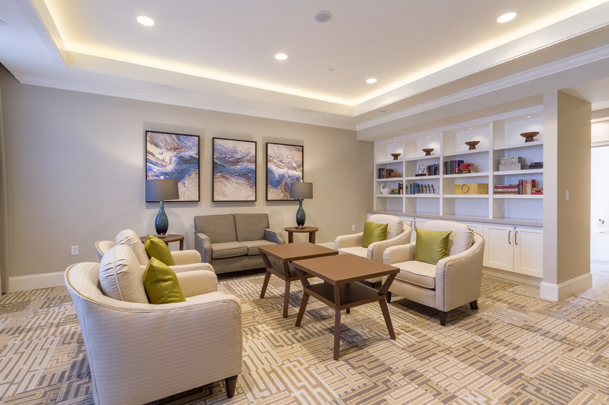 A modern living room with elegant furniture and decor.
