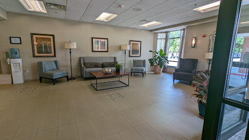 A cozy waiting area with comfortable seating and natural light.