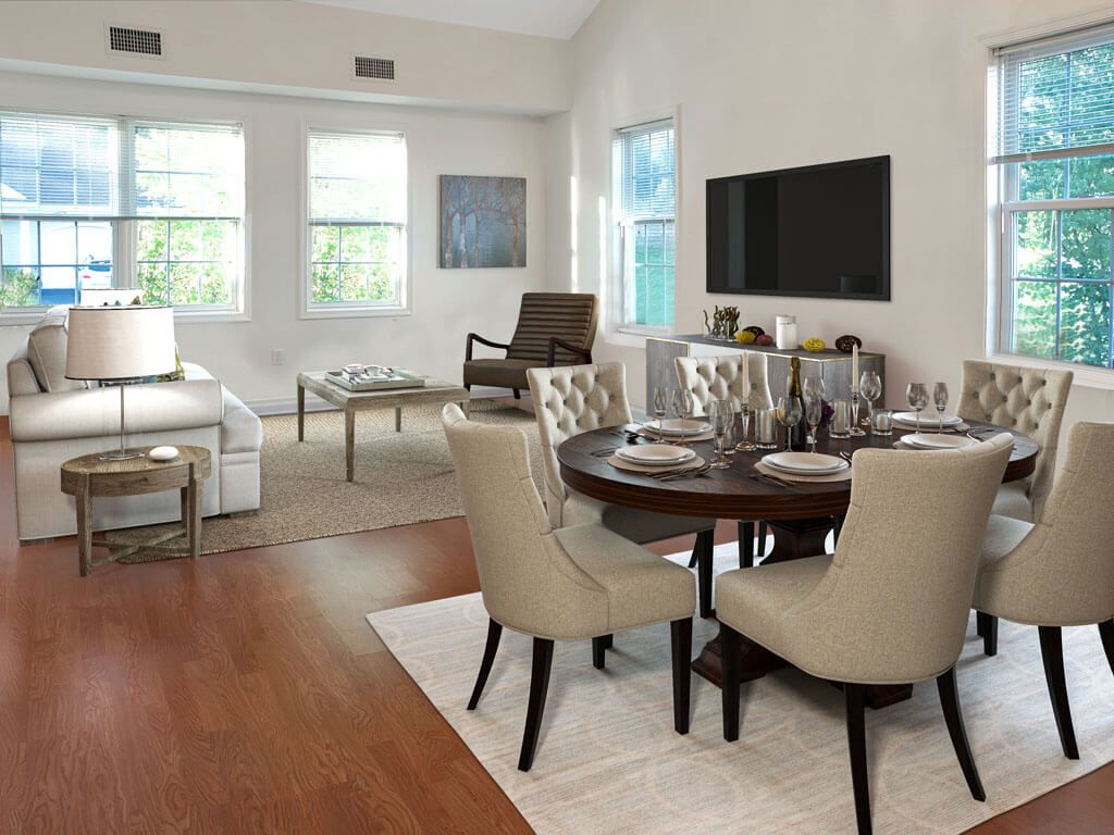 Modern living and dining area with stylish furniture and natural lighting.