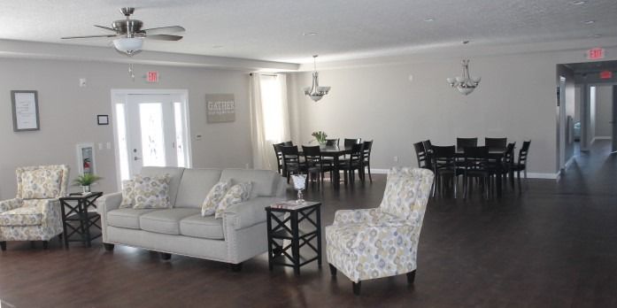 A modern open-concept living and dining space with comfortable seating and elegant furnishings.