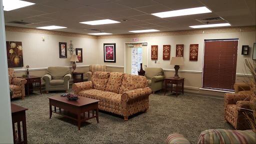 A cozy living room featuring comfortable seating and decorative elements.