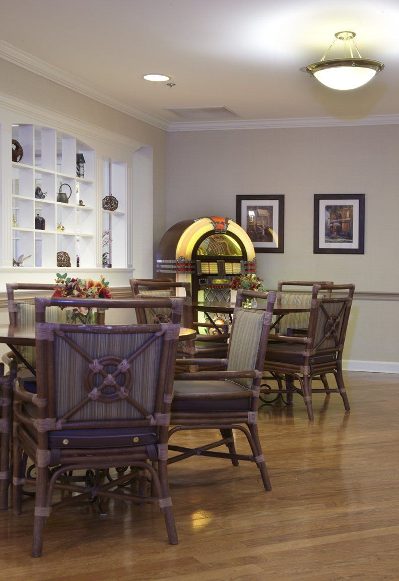 A cozy dining area featuring a vintage jukebox and stylish furniture.