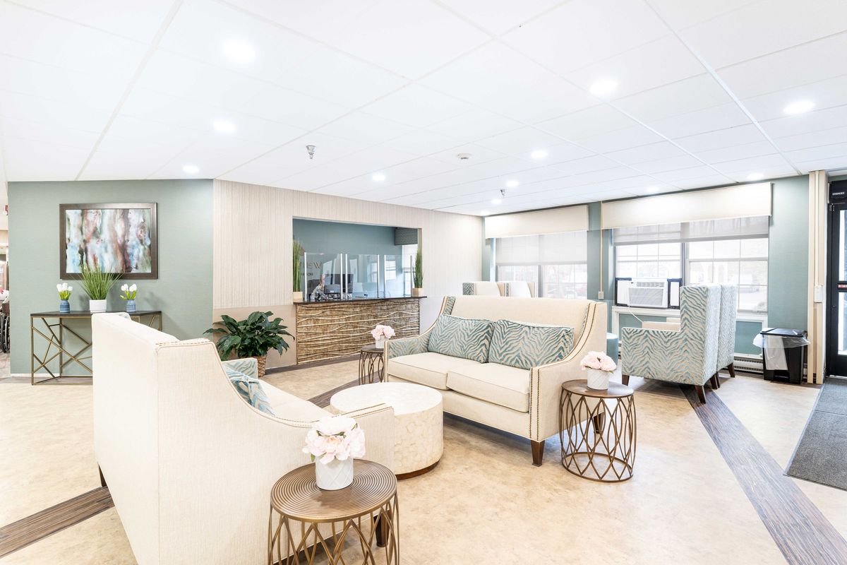 A modern living room with elegant furniture and bright lighting.