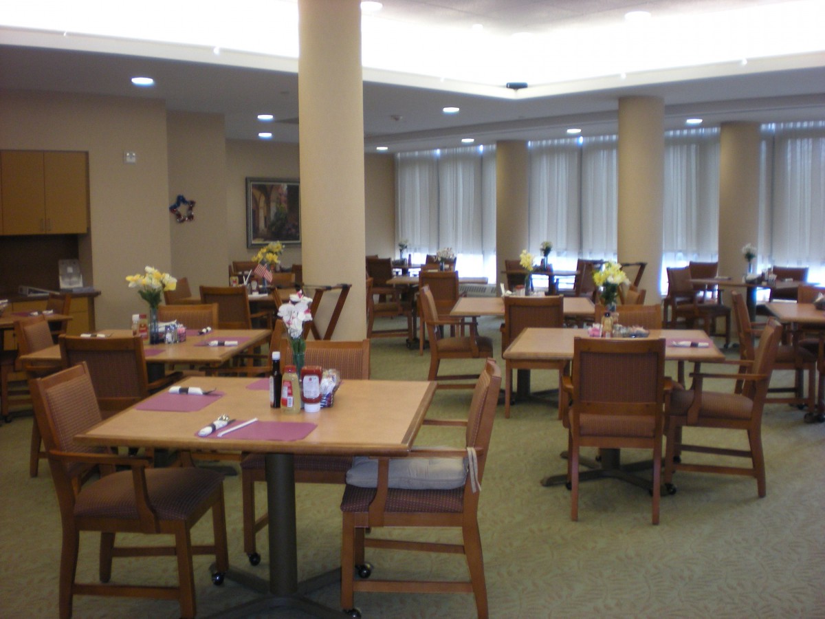 An inviting dining area with neatly arranged tables and chairs.