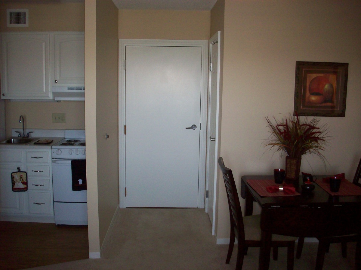 Compact apartment with a view of the kitchen and dining area.