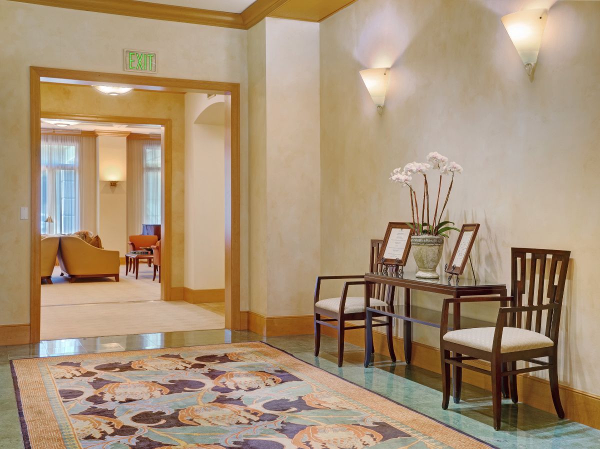A well-decorated lobby area with elegant furniture and soft lighting.