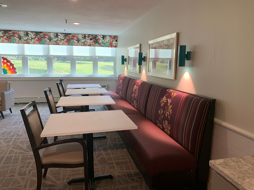 Cozy dining area with comfortable seating and natural light.