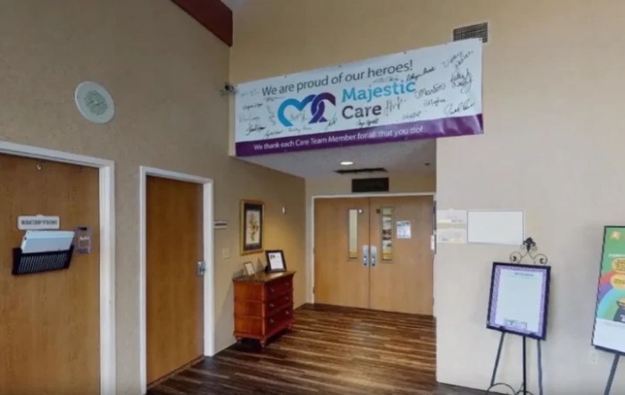 Entrance area of a healthcare facility with a welcoming banner and hallway.
