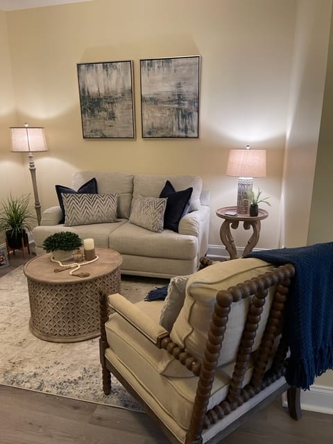 A cozy living room with stylish furniture and warm lighting.