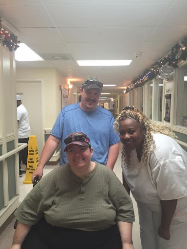 A moment of support and camaraderie in a hospital setting.