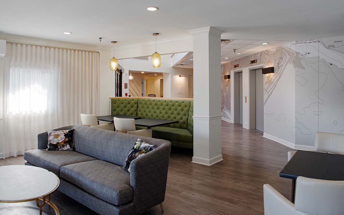 A modern living room with sleek furniture and stylish decor.