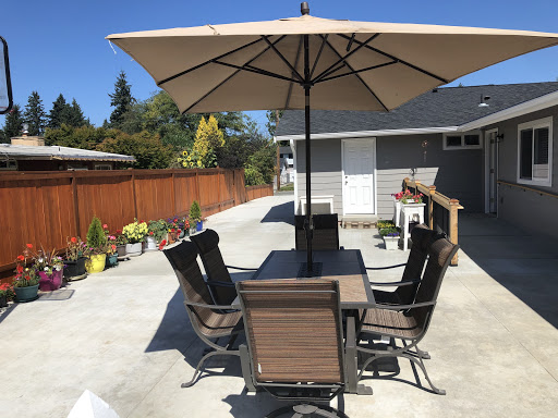 A well-furnished outdoor patio area ready for relaxation and dining.