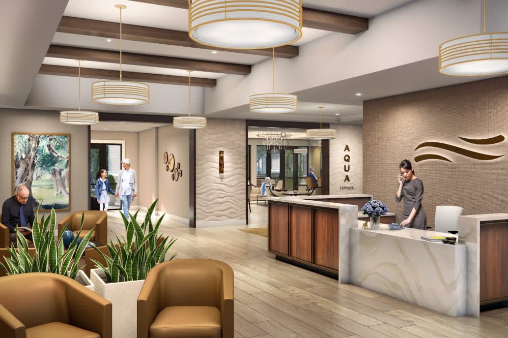 A modern and welcoming lobby area with a reception desk and comfortable seating.