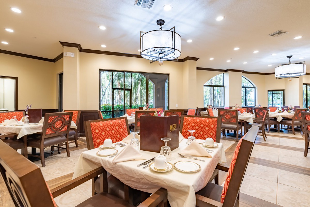 Elegant restaurant interior with neatly set tables and stylish decor.