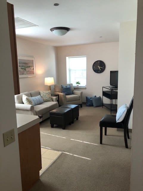A cozy living room with comfortable seating and modern decor.