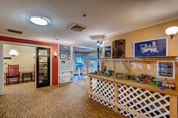 A well-decorated lobby area featuring wood flooring and a welcoming reception desk.
