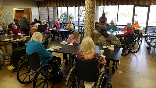 A vibrant community gathering at a senior citizens' center, where residents engage in social activities.