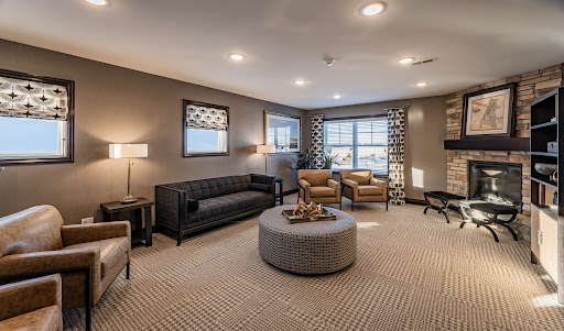 A stylish and inviting living room with modern furnishings and warm lighting.