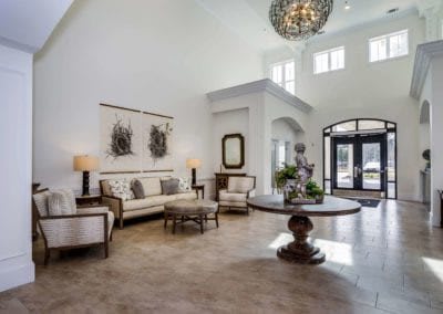 Elegant living room with a chandelier and stylish decor.