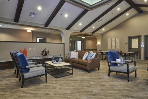 A modern living room with comfortable seating and elegant decor.
